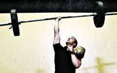 Slaying the Beast: How To Press a 48kg Kettlebell